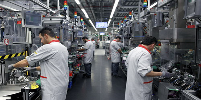 Employees work on Bosch Cp4 diesel pumps as they move along the production line at the Robert Bosch GmbH headquarters in Stuttgart, Germany, on Wednesday, Feb. 1, 2012. Robert Bosch GmbH, the world's biggest car-parts supplier, plans to invest about 77 million euros ($101 million) in a new factory in Romania, the government said in an e-mailed statement today. Photographer: Simon Dawson/Bloomberg